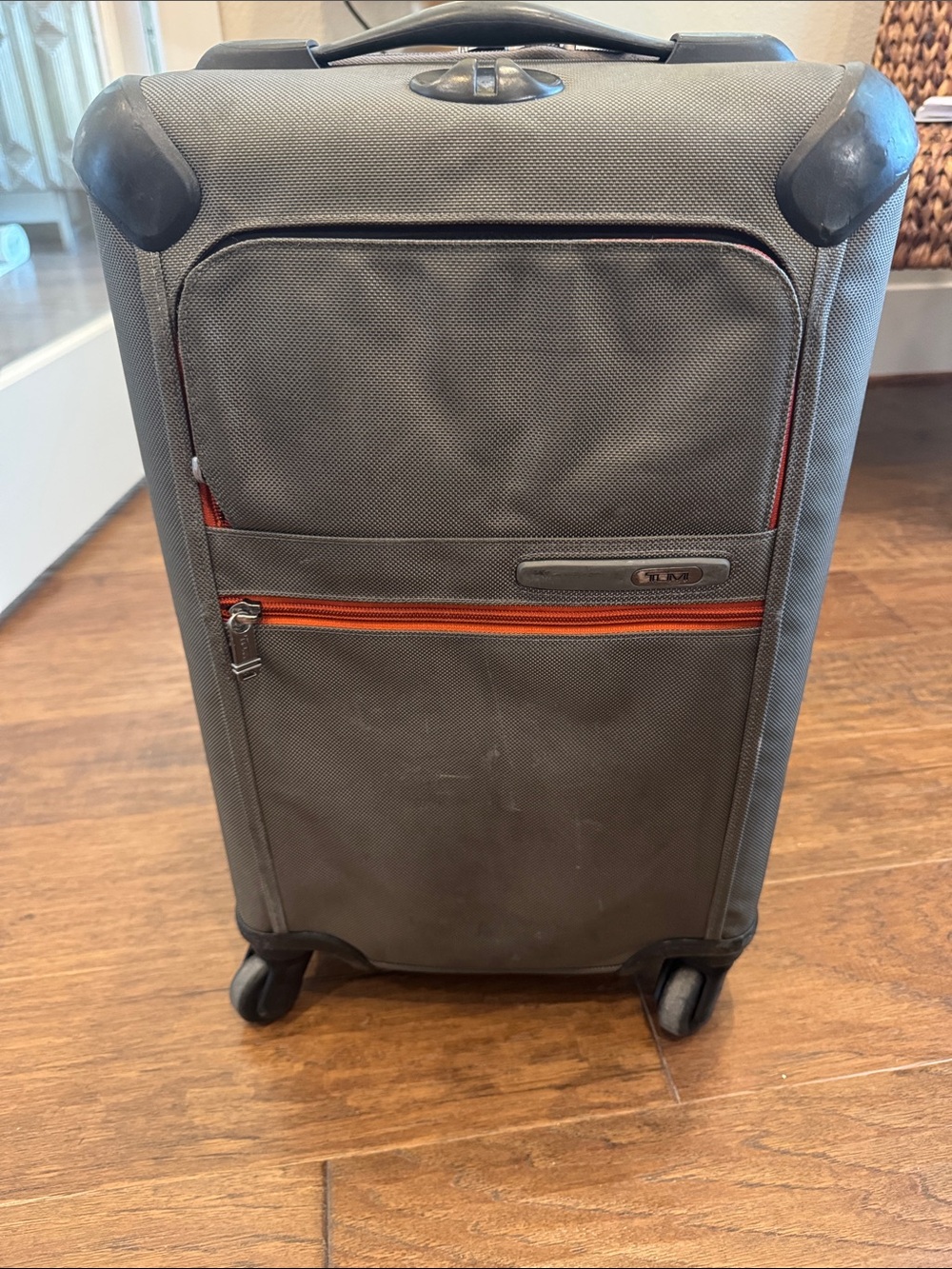 Tumi Grey Spinner Carry-On with Orange Trim